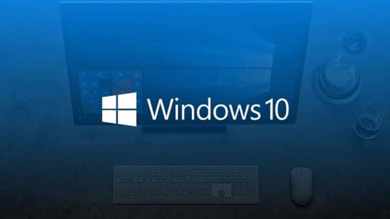 Logo windows 10 y fondo azul con tenue pc de fondo